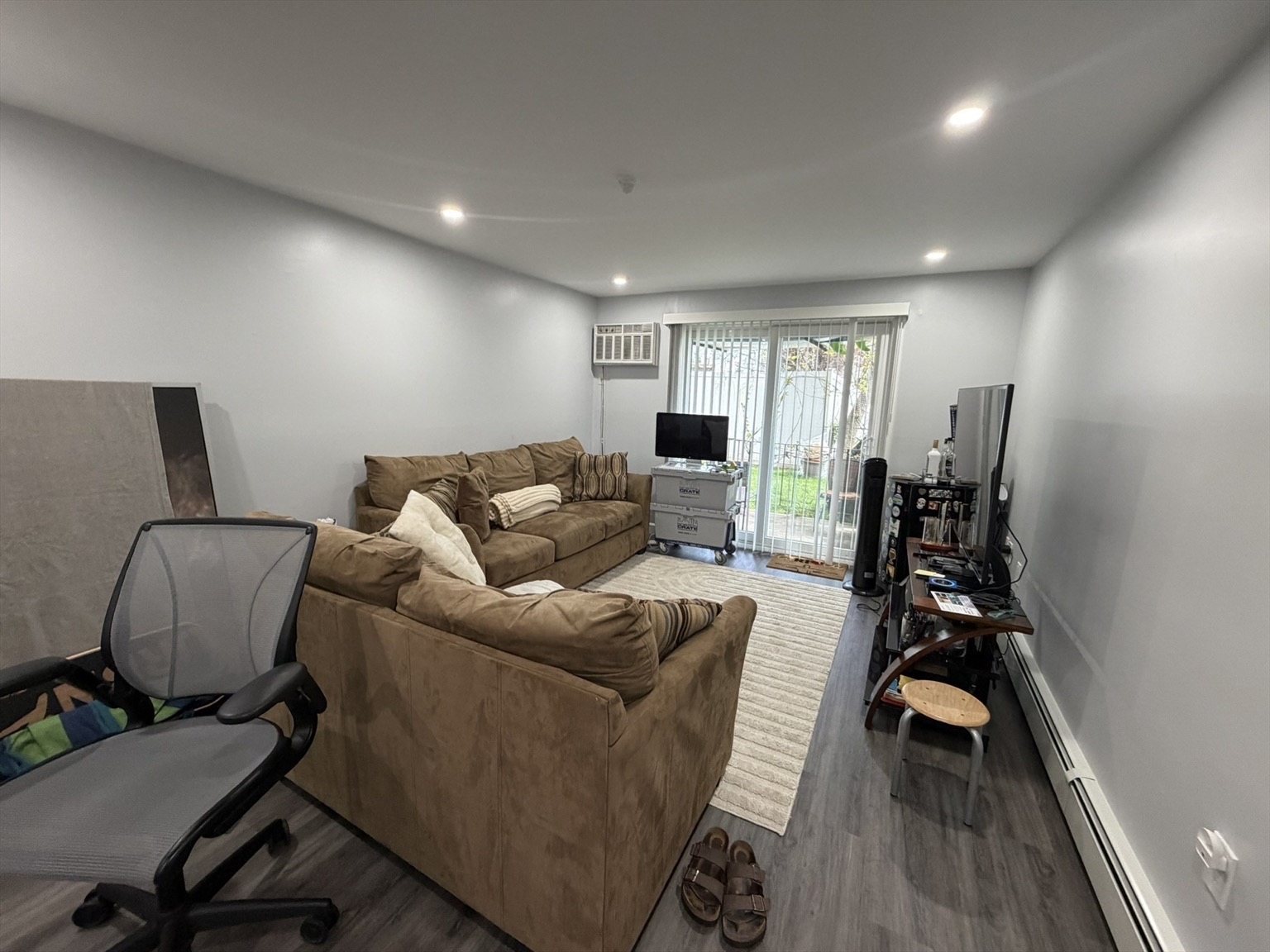 Renovated apartment living room with a slider to outside