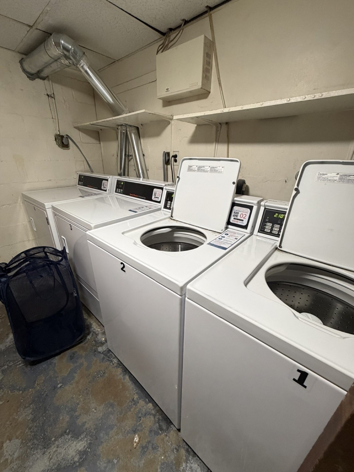 On-site coin-operated laundry room at 38 Clapp Street
